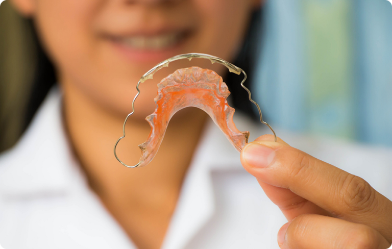 Close Up Of Woman Holding Retainer