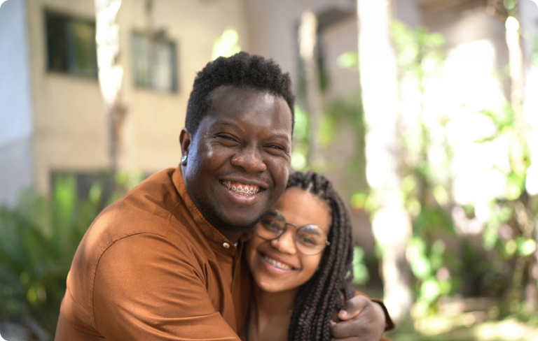 Smiling Father And Daughter Both Wearing Braces