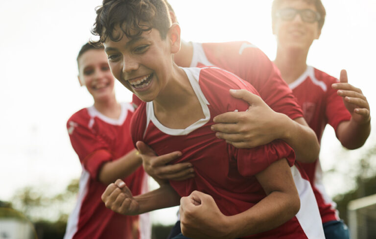 Keys Playing Soccer Embracing A Win
