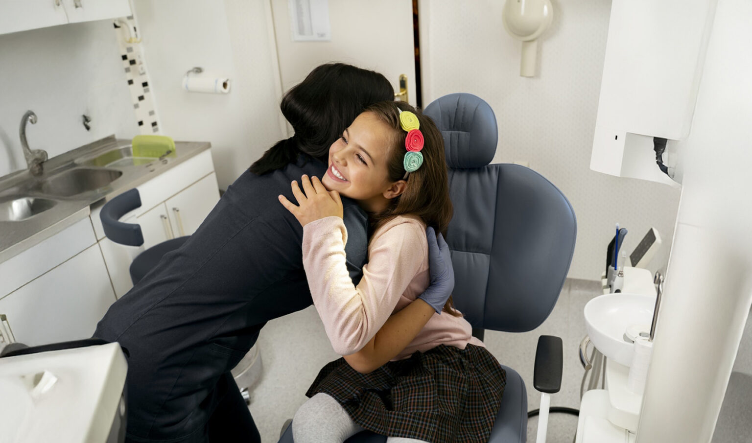 Nurse Hugging A Girl Patient