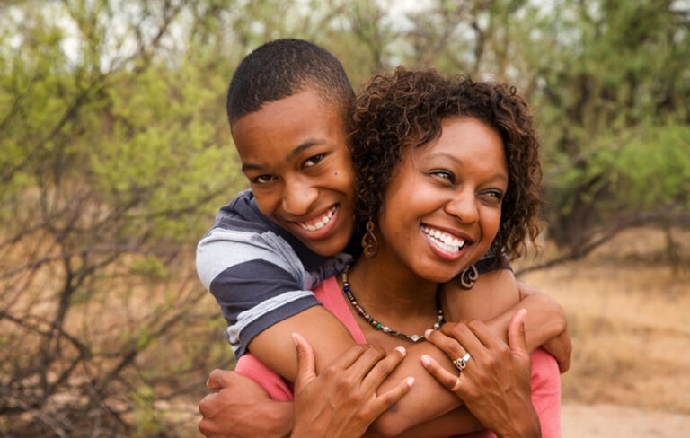 Son And Mother In Loving Hug