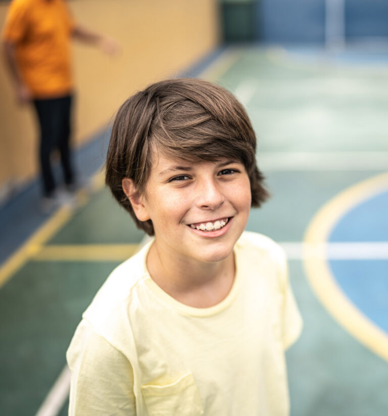 A Kid On A Basketball Court