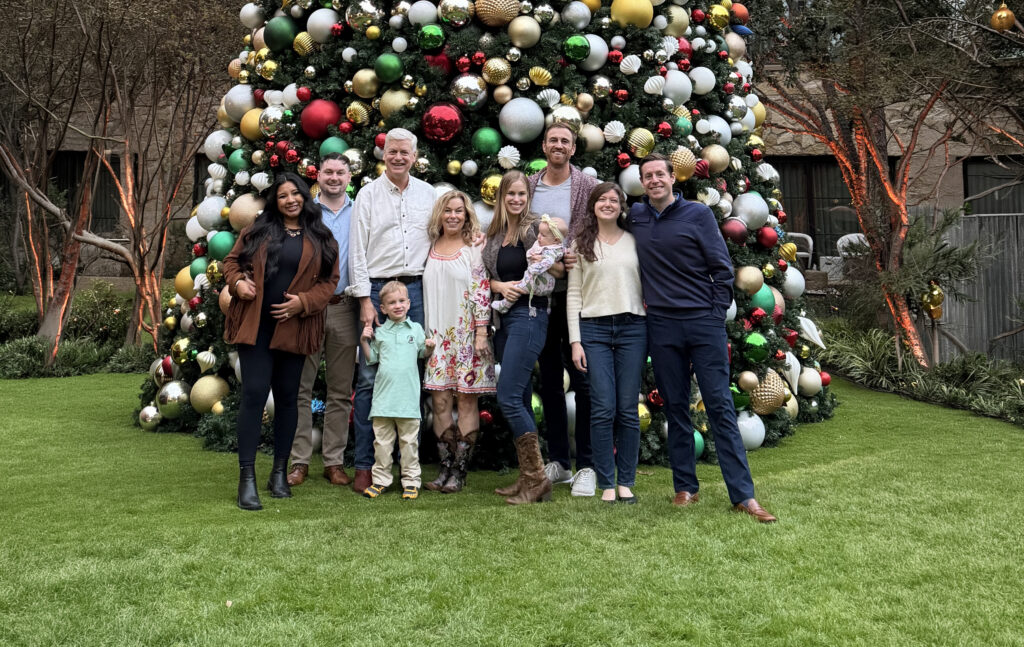 Dr Lang With The Staff In Front Of A Christmas Tree