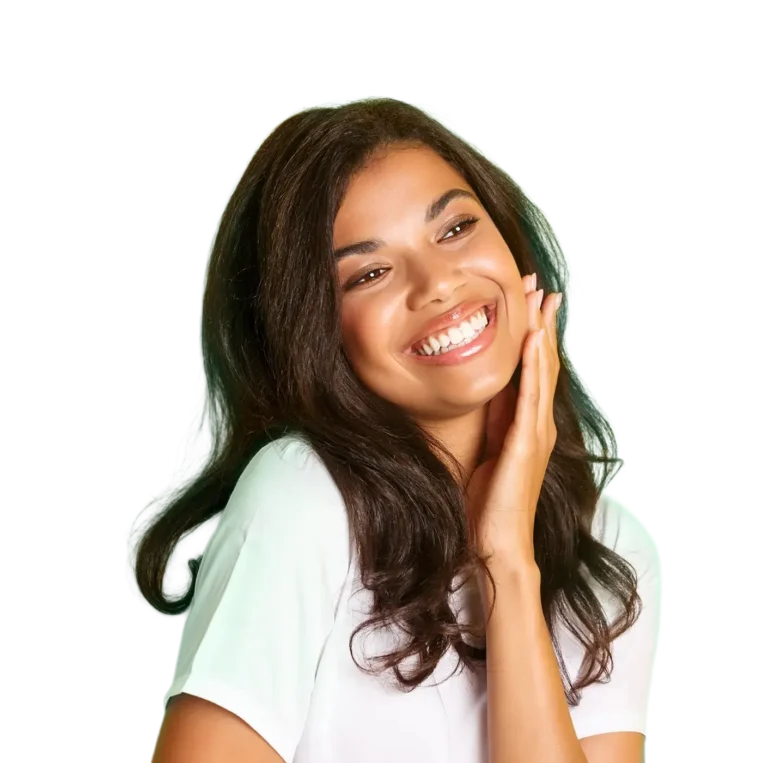 Woman Smiling Next To A Green Wall