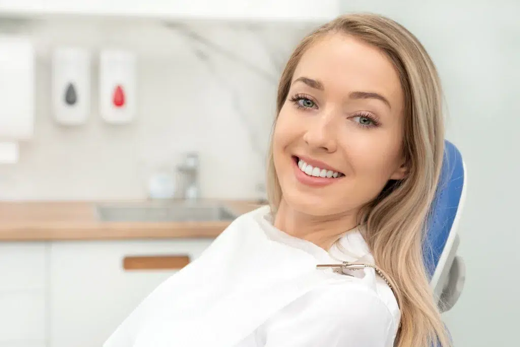 Young Woman Sitting On Chair At orthodontist office