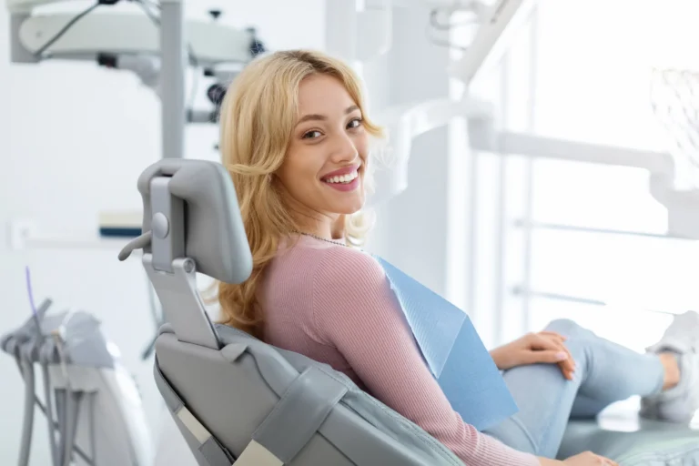 Blonde woman Patient In A Dental Chair Smiling