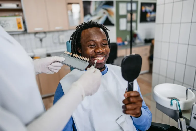 Male Consulting With Orthodontost About Veneers