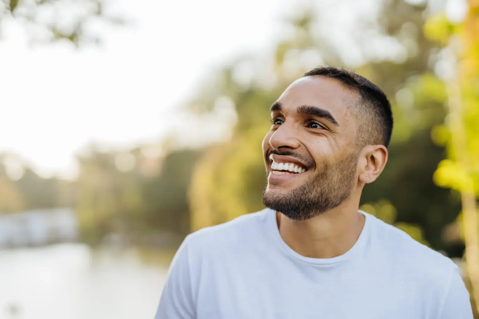 Young Smiling Athlete In Public Park Copy